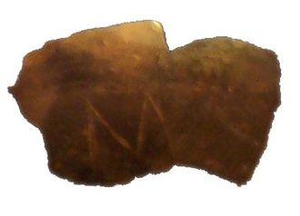 01 Fragment of a clay vessel with an M-shaped incision Neolithic Europe Vinča Serbia Danube 5,300 BC